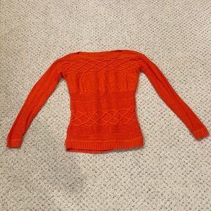 Woman’s Orange Sweater